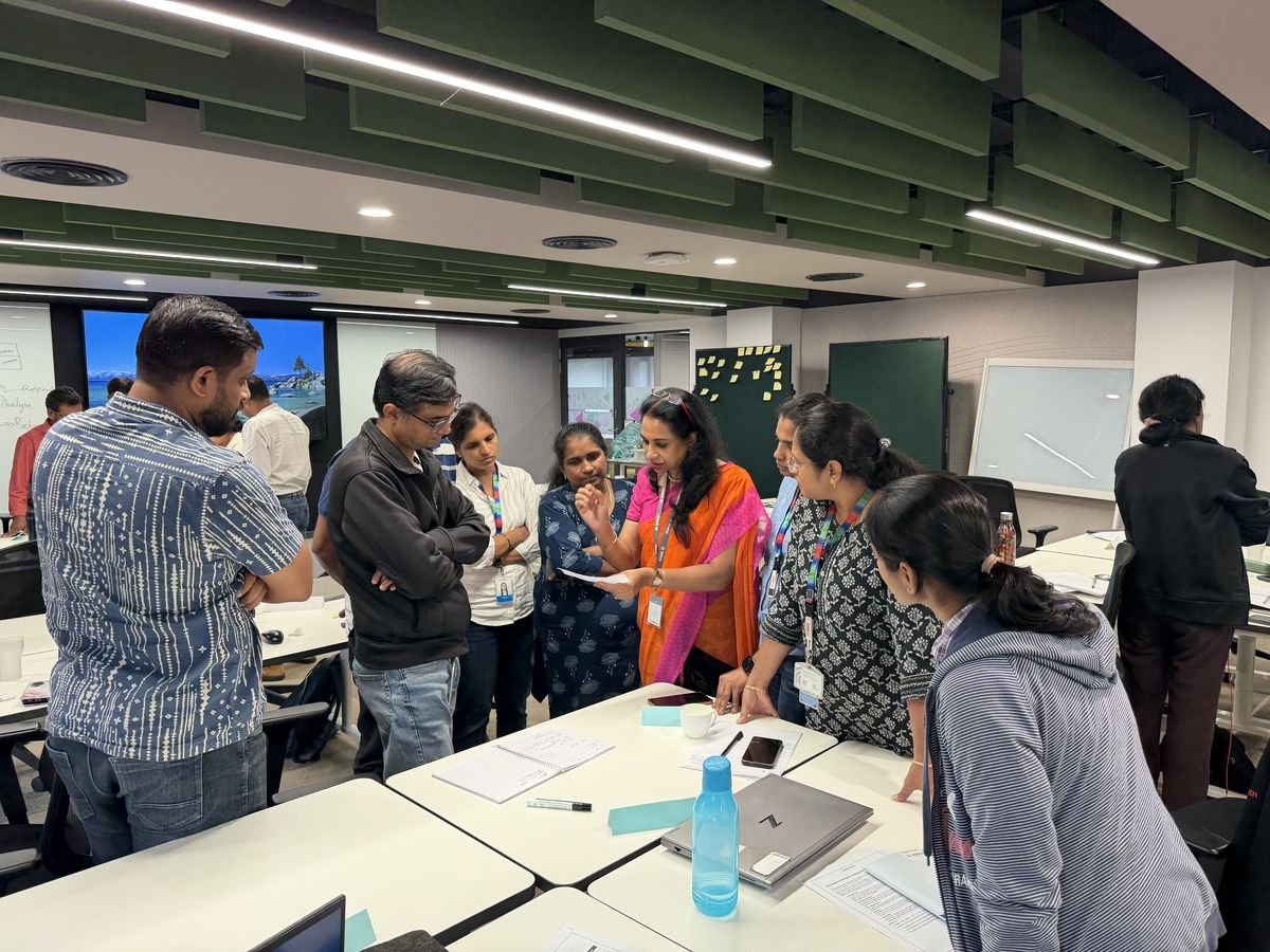 Employees working through a hands-on group activity with a Protocol trainer