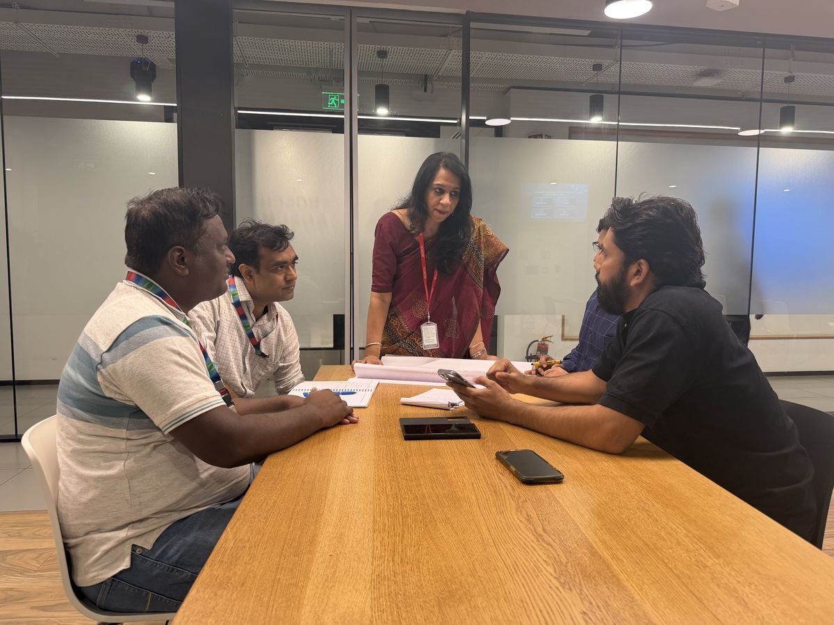 A Protocol trainer guiding a workplace role-play between employees
