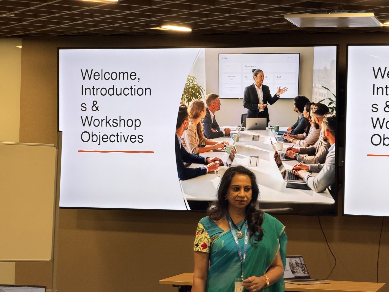 A Protocol trainer opening a corporate soft skills workshop with the session objectives on screen